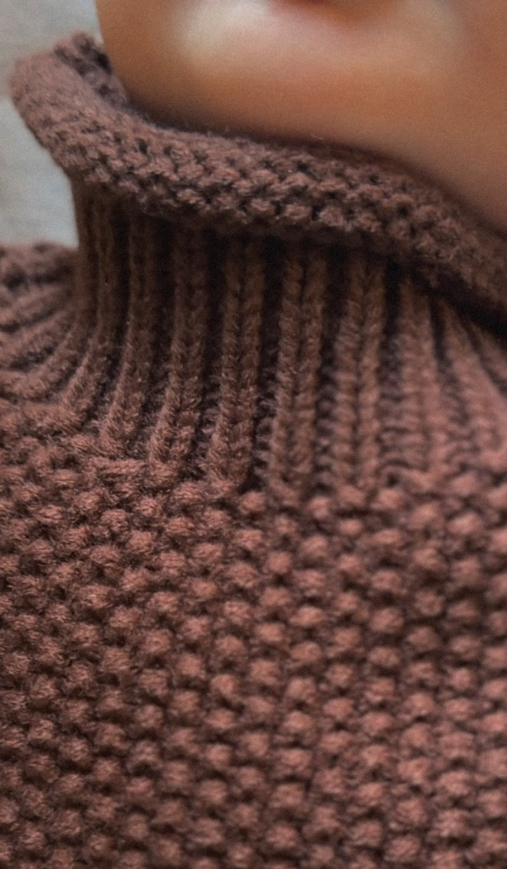 Dark brown thick, cotton polyester blend turtleneck shown on baby. 