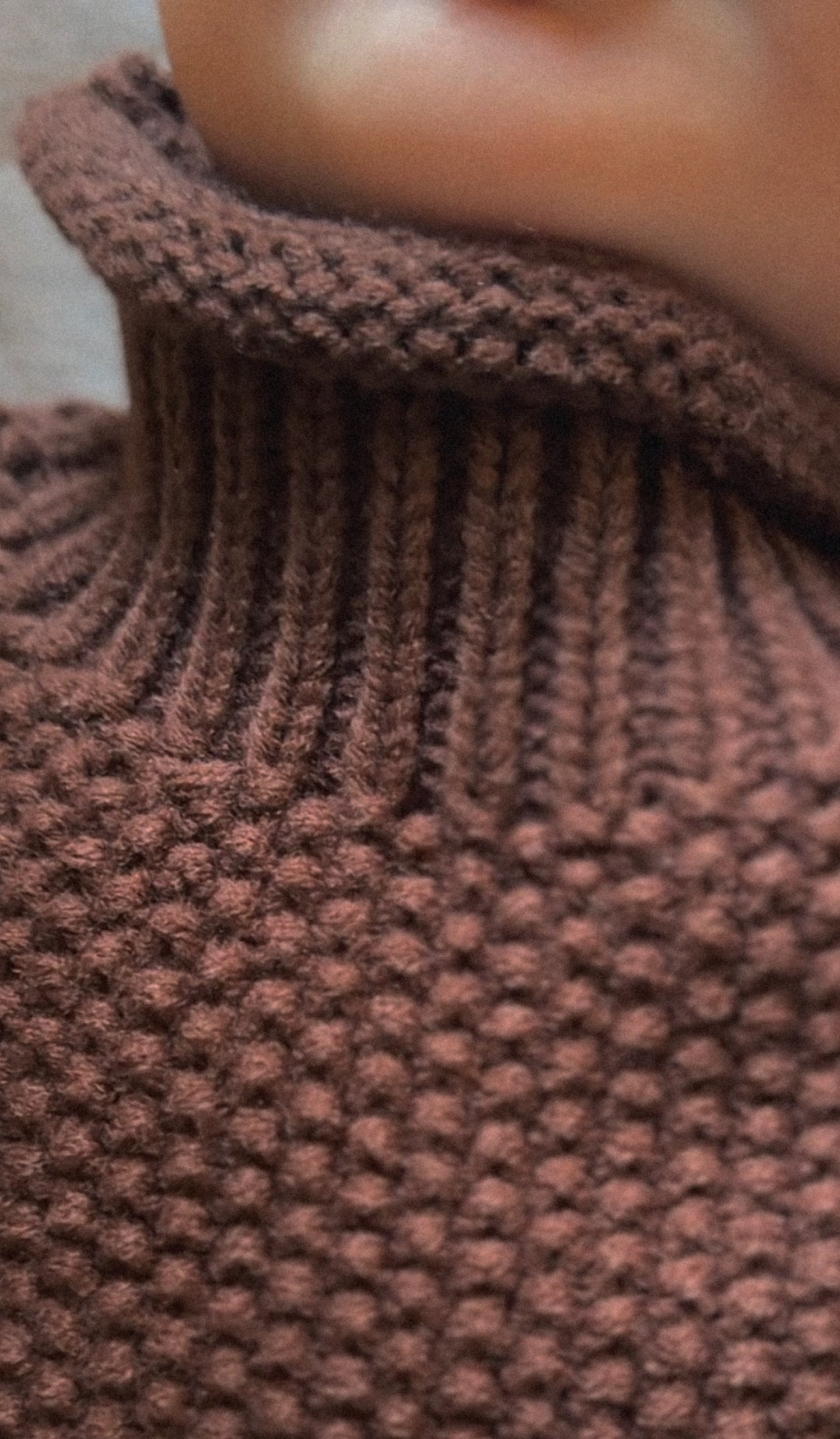 Dark brown thick, cotton polyester blend turtleneck shown on baby. 