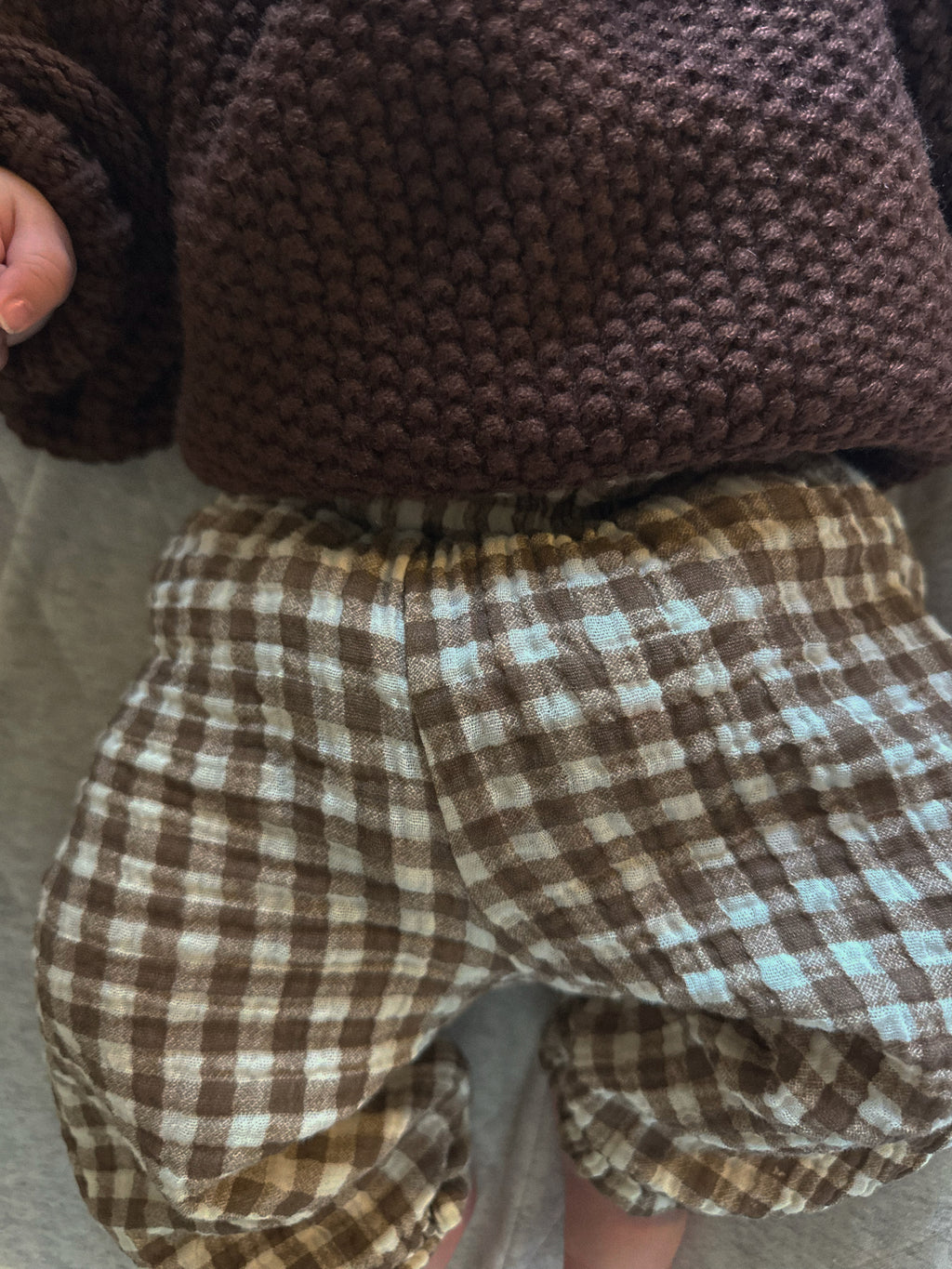 Brown gingham pants on baby, 100% cotton material. 