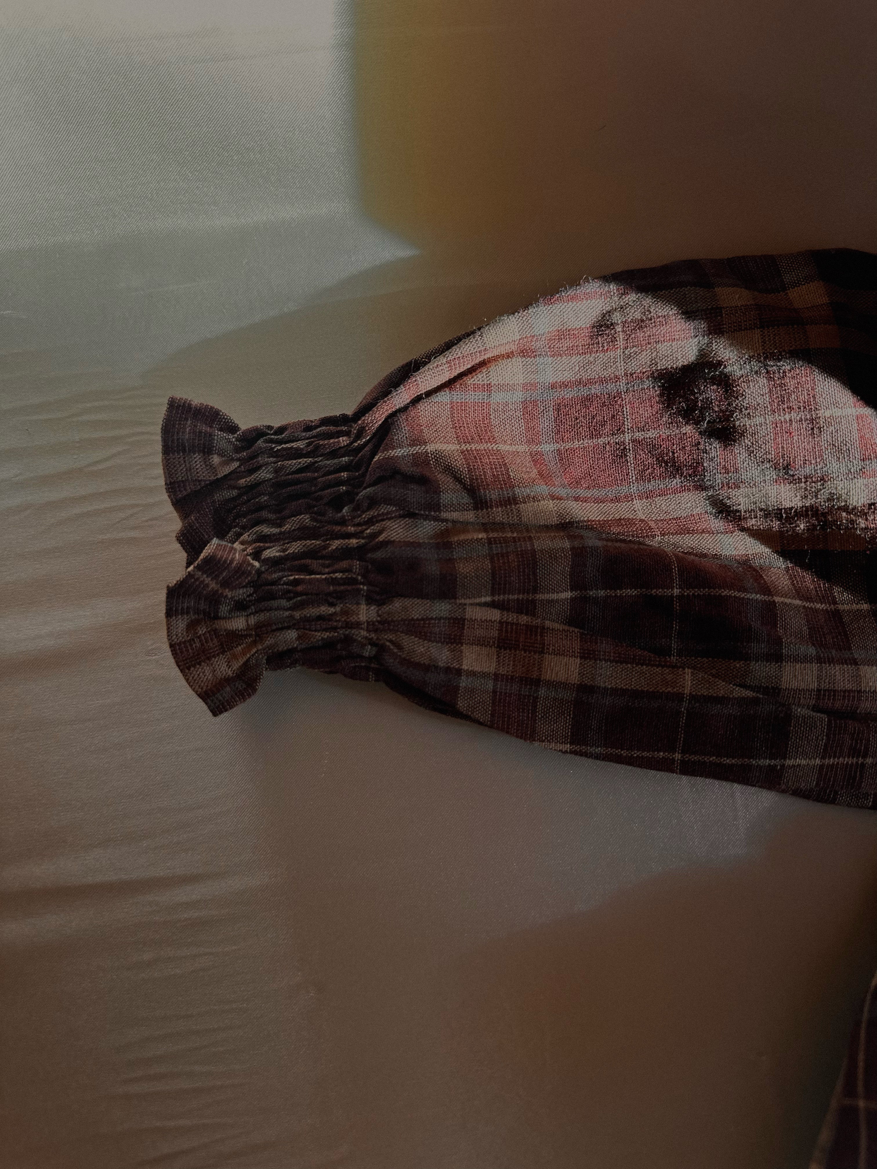 Details of gathered sleeves of 100% cotton Brownish plaid bubble romper with lace front and collar. 