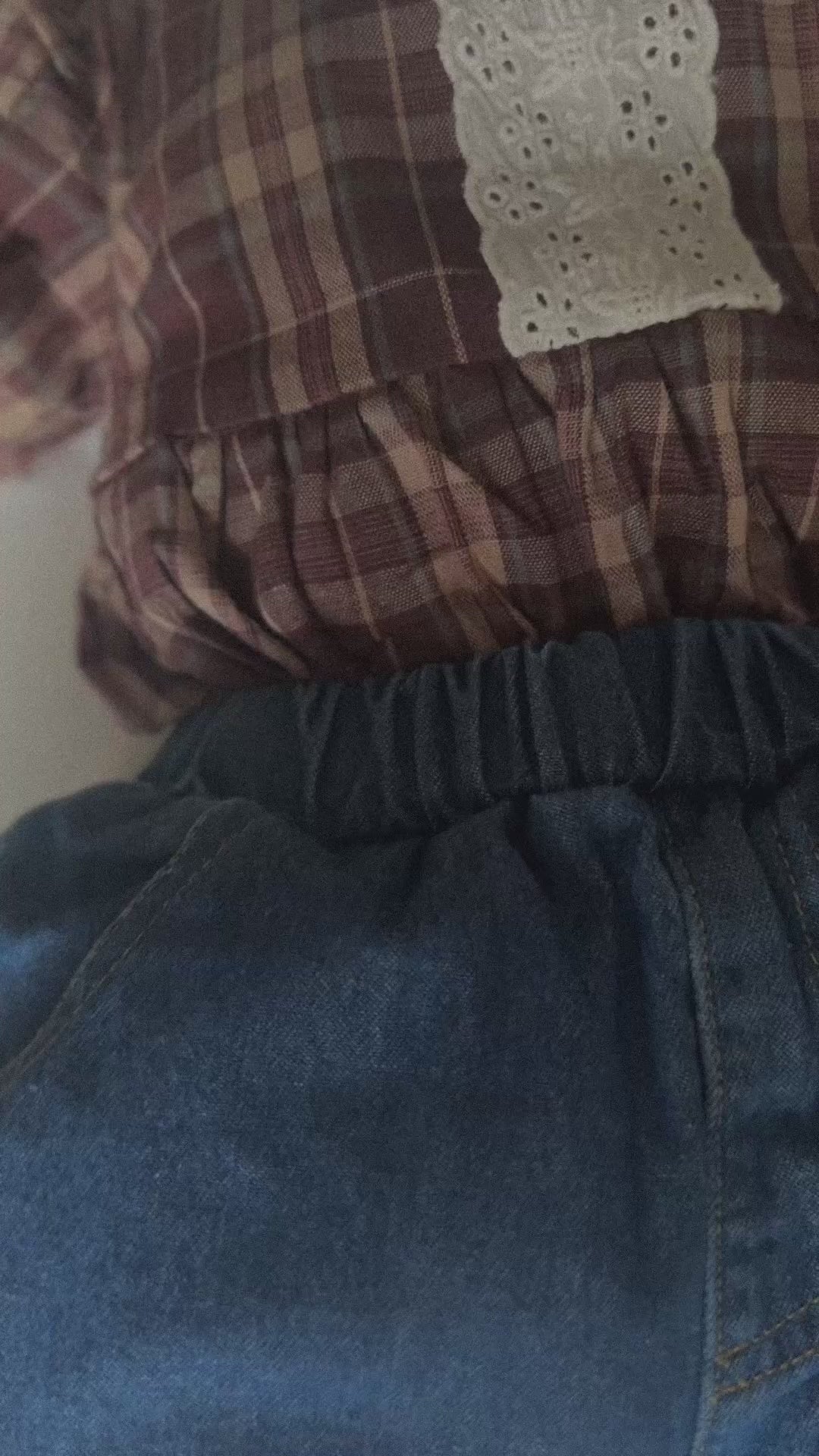 Video of baby wearing 100% cotton medium to dark wash denim jeans. 