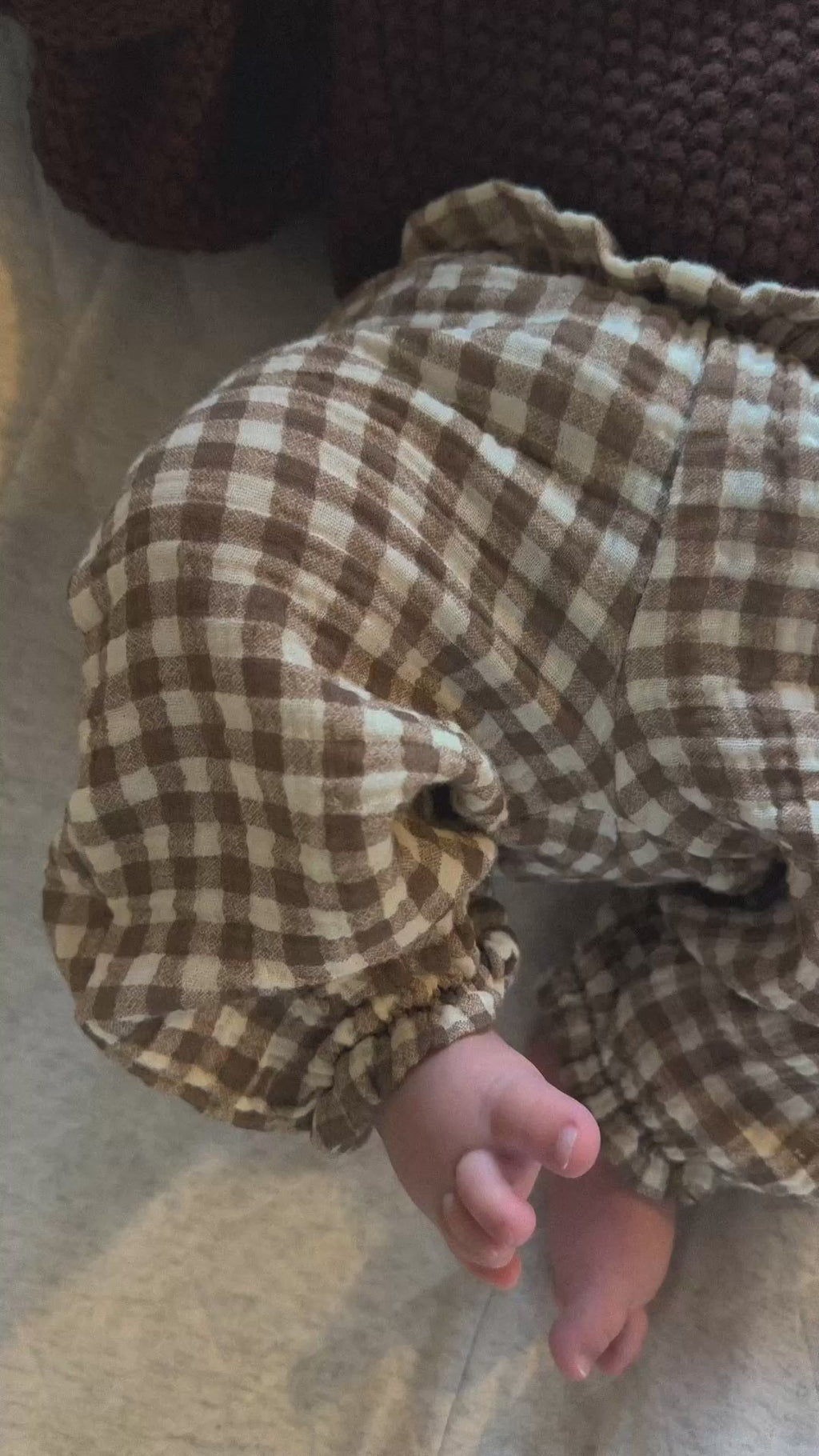 Video of brown gingham pants on baby, 100% cotton material. 
